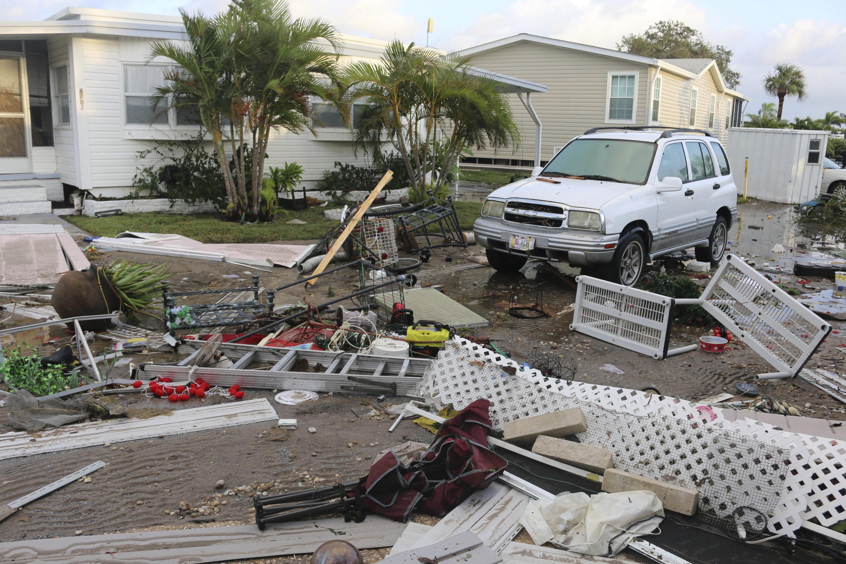 Debris covered the road at Harbor Lights Club mobile home park in Pinellas County, Florida, on Friday after Hurricane Helene.