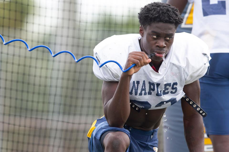 Naples’ Isaiah Augustave reacts during football practice, Tuesday, Aug. 9, 2022, at Naples High School in Naples, Fla.