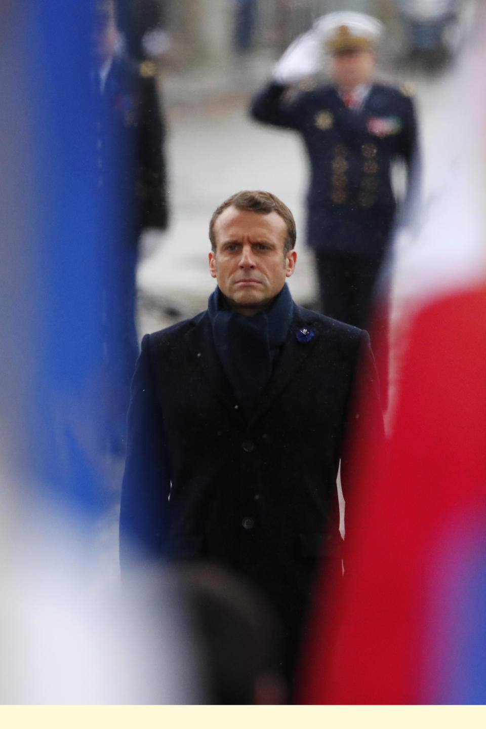 French President Emmanuel Macron stands at attention at the tomb of the Unknown Soldier under the Arc de Triomphe in Paris Monday Nov. 11, 2019 during commemorations marking the 101st anniversary of the 1918 armistice, ending World War I. (AP Photo/Francois Mori, Pool)