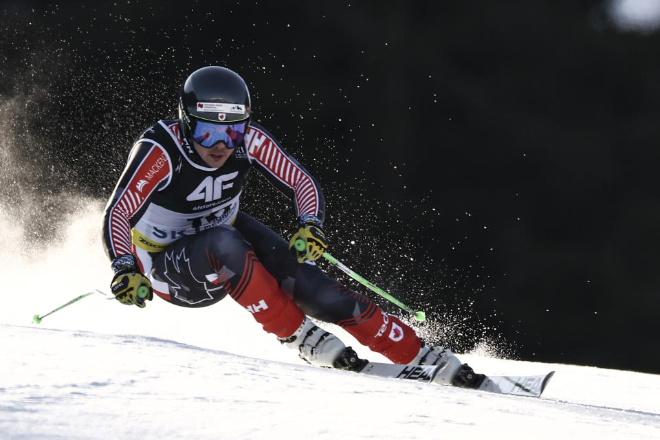 Canada's James Crawford speeds down the course during an alpine ski, men's World Championship super-G race, in Courchevel, France, Thursday, Feb. 9, 2023. (AP Photo/Gabriele Facciotti)