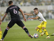 Columbus Crew's Alexandru Irinel Matan, right, tries to dribble past Inter Miami's Leandro Gonzalez Pirez during the second half of an MLS soccer match Saturday, Oct. 16, 2021, in Columbus, Ohio. (AP Photo/Jay LaPrete)