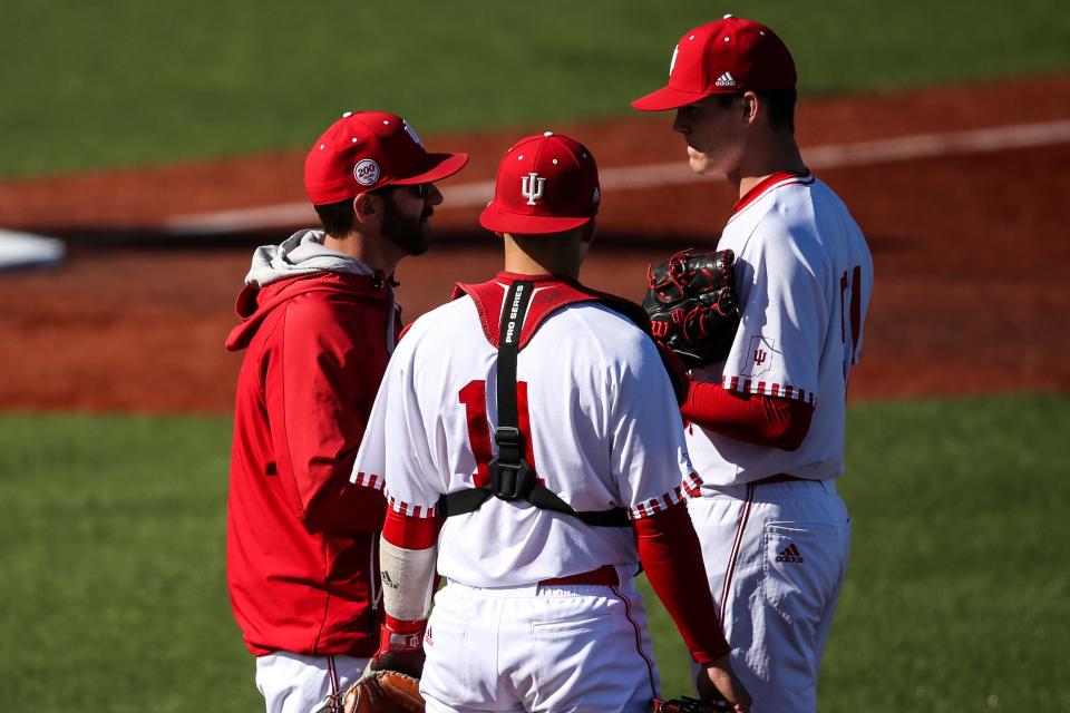 Justin Parker, left, during his time as Indiana baseball's pitching coach.