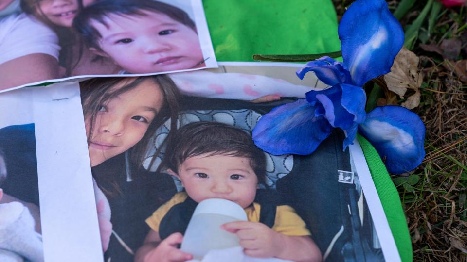 A memorial of photos, flowers and stuffed animals was set up in front of the home of Samantha Ross, 7, and her 11-month-old brother, Paul Ross. The children's mother, Yuhwei Chou, was charged with their deaths.