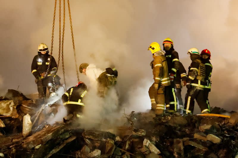 Aftermath of Dnipro apartment block destruction following missile strike