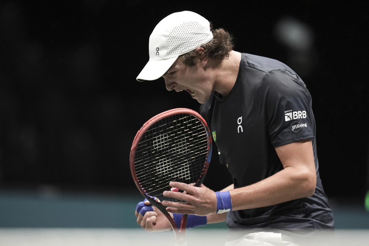 Brazil's Joao Fonseca reacts after winning a point as he plays Belgium's Raphael Collignon during their Davis Cup tennis match at the Unipol Arena, Bologna, Italy, Saturday, Sept. 14, 2024. (Massimo Paolone/LaPresse via AP)