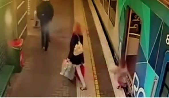 Horrifying moment toddler falls between train and platform (video)