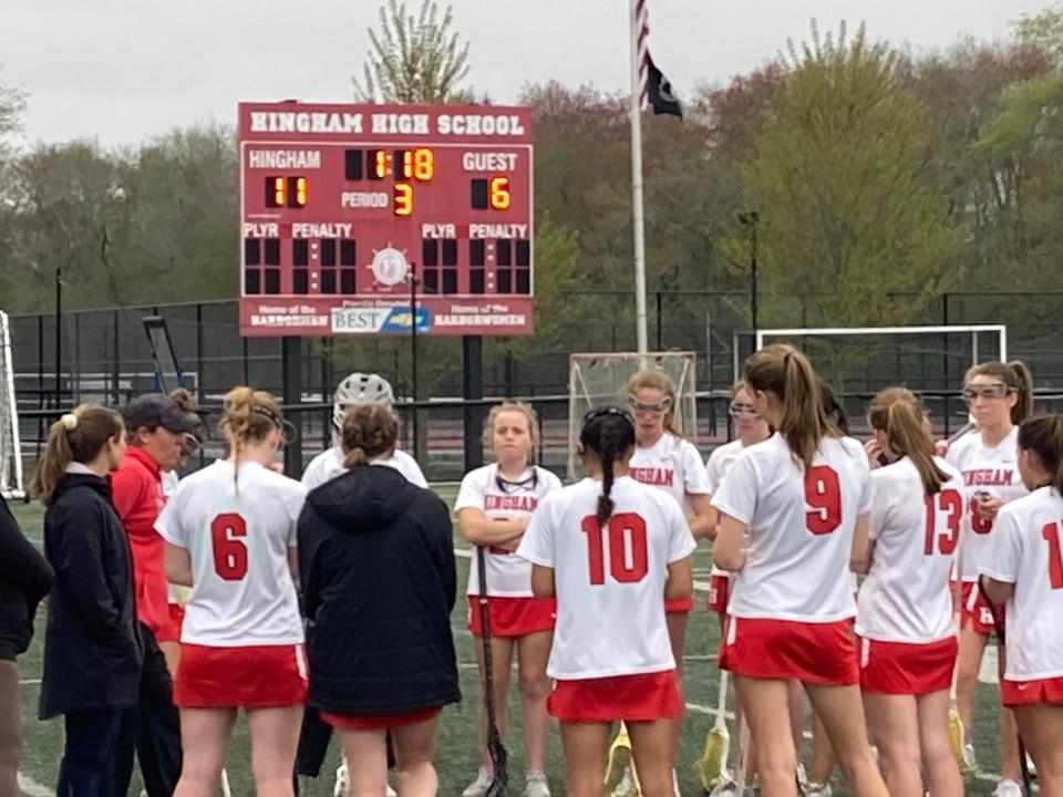 The Hingham High girls lacrosse team huddled up at halftime during a game vs. Hanover on Wednesday, May 8, 2024. The Harborwomen won, 19-9, for their 10th straight victory.