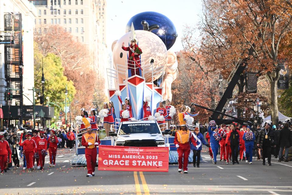 Miss America 2023 Grace Stanke waves from a float at the  2023 Macy's Thanksgiving Day Parade.