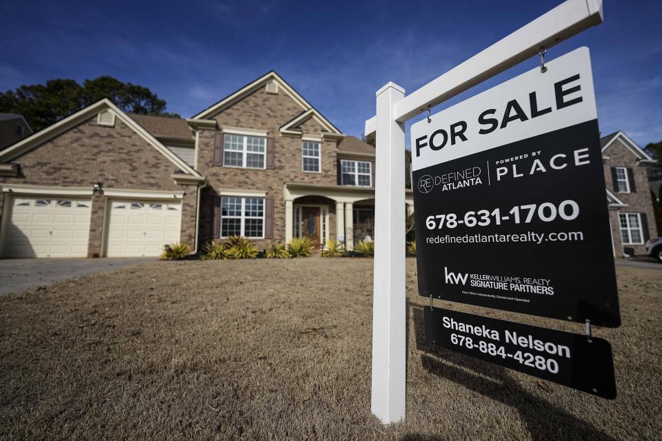 FILE - A sign announcing a home for sale is posted outside a residence, Feb. 1, 2024, in Aceworth, Ga., near Atlanta. The cost of hiring a real estate agent to buy or sell a home is poised to change along with decades-old rules that have helped determine broker commissions. (AP Photo/Mike Stewart, File)