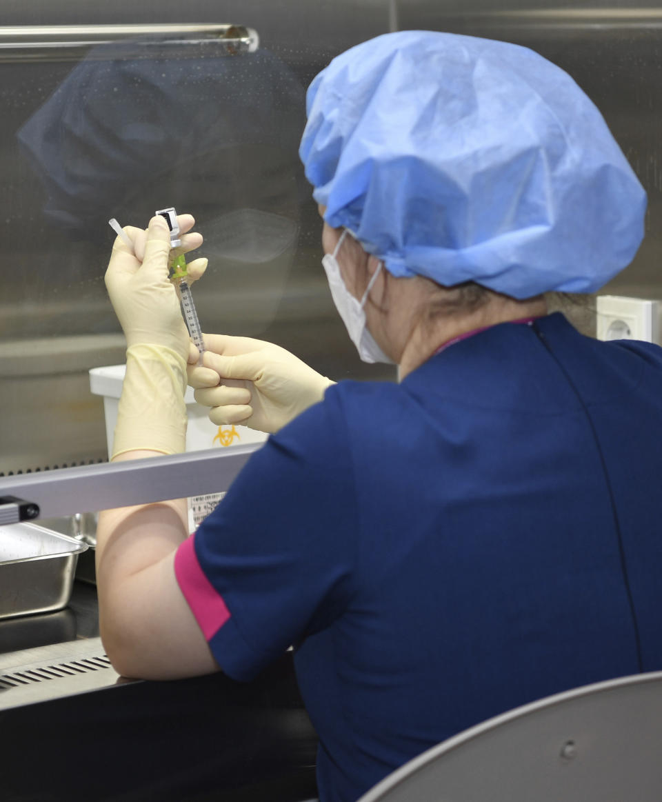 A nurse fills a syringe with the Pfizer BioNTech COVID-19 vaccine at the National Medical Center vaccination center in Seoul Saturday, Feb. 27, 2021. (Song Kyung-Seok/Pool Photo via AP)