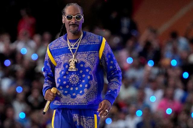 Snoop Dogg enjoys some bud before performing at Super Bowl