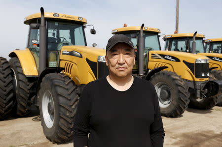 Farmer Davjigbold Ariunbold poses for pictures during an interview with Reuters, near Ulaanbaatar, in Talbulag, Jargalant district, Tov province, Mongolia, August 26, 2015. REUTERS/B. Rentsendorj