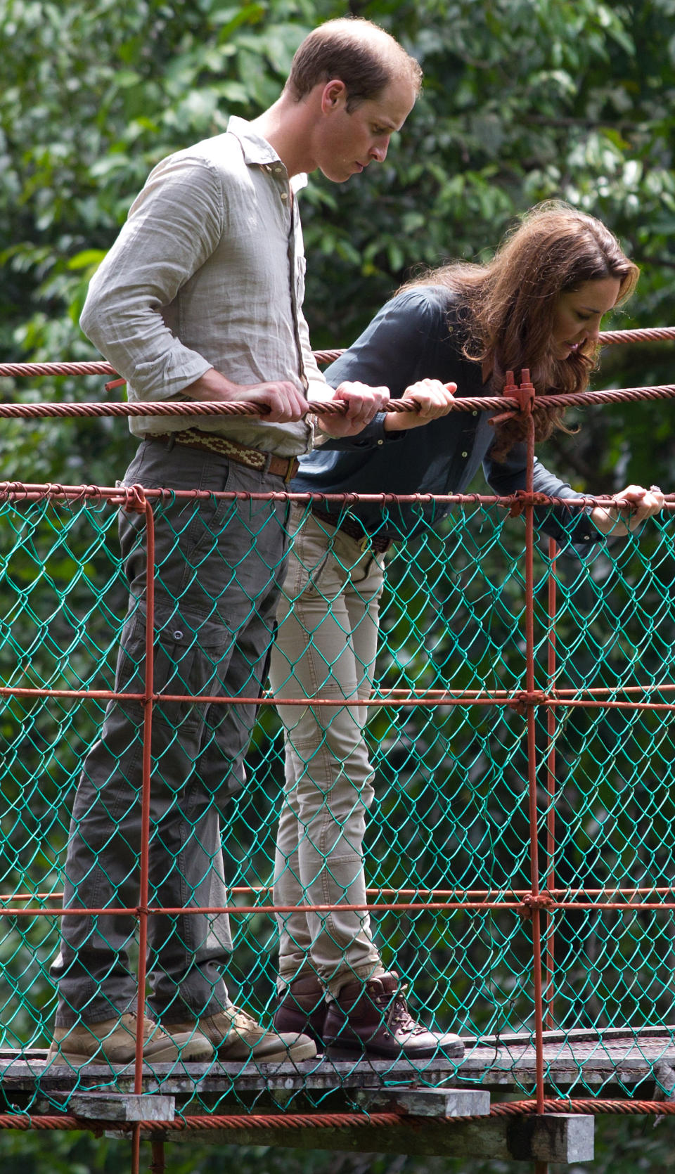 Britain's Prince William, left, and Kate, the Duchess of Cambridge look down on the three-hundred meter in length Canopy Walkway during their visit at the Borneo Rainforest Lodge in Danum Valley, some 70 kilometers (44 miles) west of Lahad Datu, on the island of Borneo Saturday, Sept. 15, 2012. (AP Photo/Mohd Rasfan, Pool)