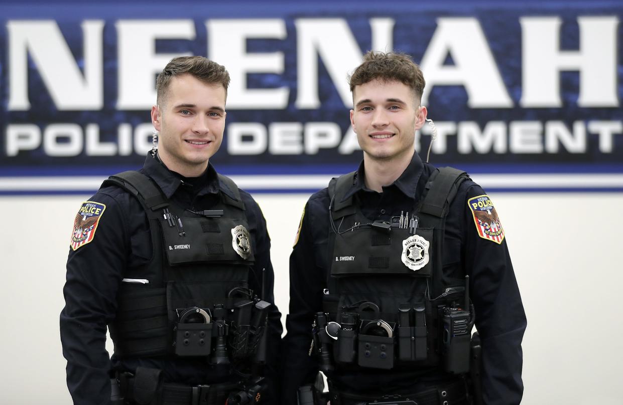 Neenah police officers and twin brothers, Bryce Sweeney, left, and Brandon Sweeney, right, come from a family of first responders.