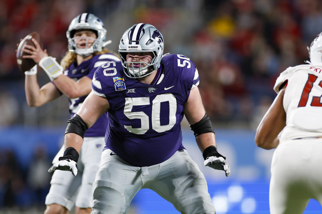 ORLANDO, FL - DECEMBER 28: Kansas State Wildcats offensive lineman Cooper Beebe (50) blocks during the game between the North Carolina State Wolfpack and the Kansas State Wildcats on December 28, 2023 at Camping World Stadium in Orlando, Fl. (Photo by David Rosenblum/Icon Sportswire via Getty Images)