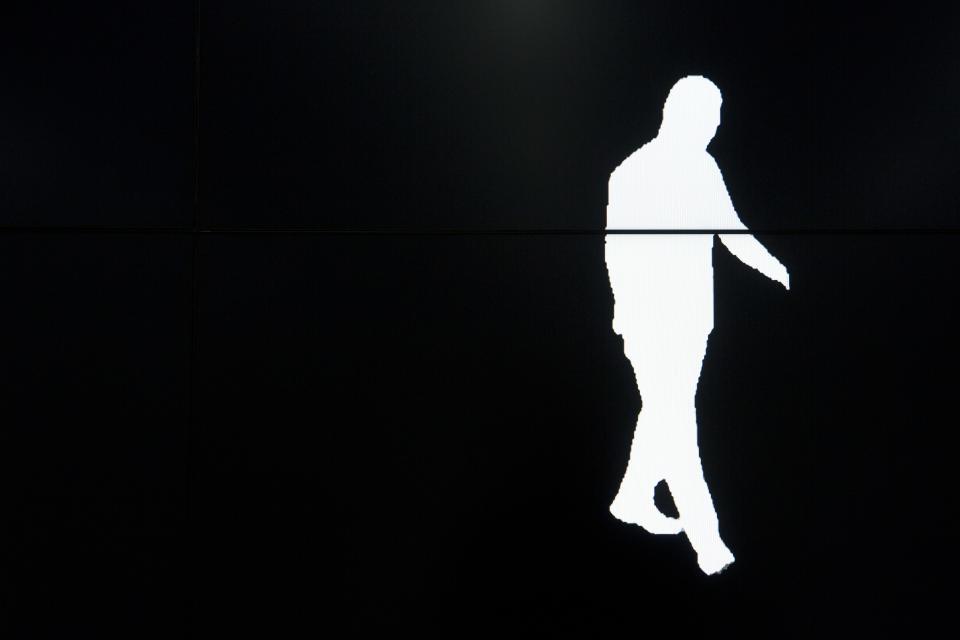 In this Oct. 31, 2018, photo, a screen displays a computer-generated image of a Watrix employee walking during a demonstration of their firm's gait recognition software at their company's offices in Beijing. A Chinese technology startup hopes to begin selling software that recognizes people by their body shape and how they walk, enabling identification when faces are hidden from cameras. Already used by police on the streets of Beijing and Shanghai, “gait recognition” is part of a major push to develop artificial-intelligence and data-driven surveillance across China, raising concern about how far the technology will go. (AP Photo/Mark Schiefelbein)