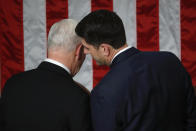 <p>Ryan whispers to the vice president before the State of the Union address to a joint session of Congress on Capitol Hill in Washington, D.C., on Jan. 30. (Photo: Pablo Martinez Monsivais/AP) </p>