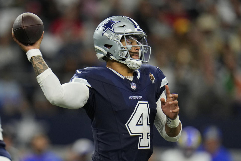 Dallas Cowboys quarterback Dak Prescott (4) throws a pass during the first half of an NFL football game against the Los Angeles Rams Sunday, Oct. 29, 2023, in Arlington, Texas. (AP Photo/Julio Cortez)