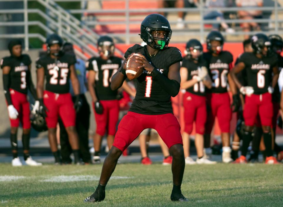 West Florida High Quarterback Markell Redding looks for an open receiver downfield during Friday night's Spring football game against Washington High. 