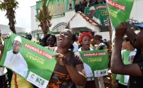 Supporters of Malian opposition leader and presidential candidate Soumaila Cisse hold posters reading "Together, let's restore hope"