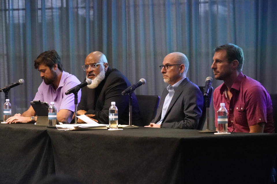 Tony Clark, second from left, executive director of the baseball players association, appears at a news conference with pitcher Andrew Miller, left, Bruce Meyer, chief union negotiator, second from right, and New York Mets pitcher Max Scherzer, right, Tuesday, March 1, 2022, in Jupiter, Fla. Major League Baseball has canceled opening day. Commissioner Rob Manfred announced Tuesday the sport will lose regular-season games over a labor dispute for the first time in 27 years after acrimonious lockout talks collapsed in the hours before management's deadline. (AP Photo/Wilfredo Lee)