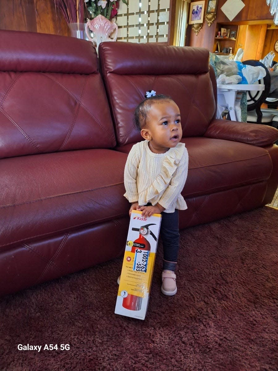 Latoya Groves shared a picture of her daughter, Zamaria, at home with a fire extinguisher.