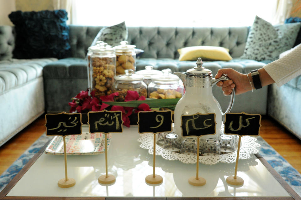 Eid greetings, which wish wellness for the year, make up decorations around sweets and Arabic coffee at the home of the Yemeni-American Muslim Udayni family on the Eid al-Fitr holiday in Brooklyn, New York, U.S., on June 25, 2017.&nbsp;