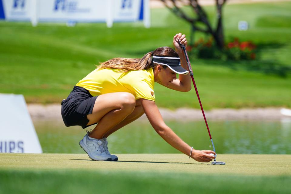 ASU senior, Alessandra Fanali, places her marker at the 18th hole in the third round of the NCAA Women's Golf Championship at Grayhawk Golf Club on May 22, 2022, in Scottsdale, AZ.