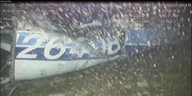 In this image released Monday Feb. 4, 2019, by the UK Air Accidents Investigation Branch (AAIB) showing the rear left side of the fuselage including part of the aircraft registration N264DB that went missing carrying soccer player Emiliano Sala, when it disappeared from radar contact on Jan. 21 2019. The Air accident investigators say one body is visible in the sea in the wreckage of the plane that went missing carrying soccer player Emiliano Sala and his pilot David Ibbotson. (AAIB via AP)