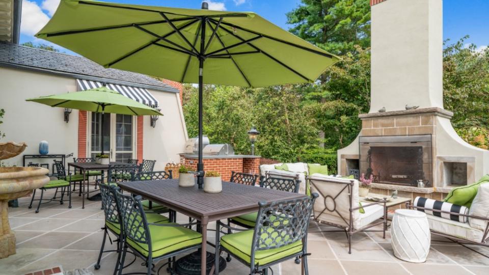 The outdoor patio with fireplace - Credit: LuxQue Media/Mike Aghachi