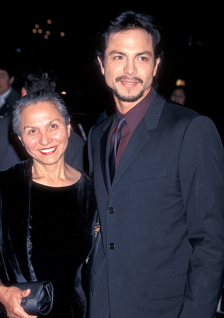 Benjamin and his mother smiling at an event