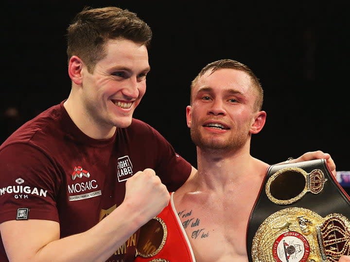 <p>Carl Frampton celebrates with trainer Shane McGuigan after victory over Scott Quigg in 2016</p> (Getty)