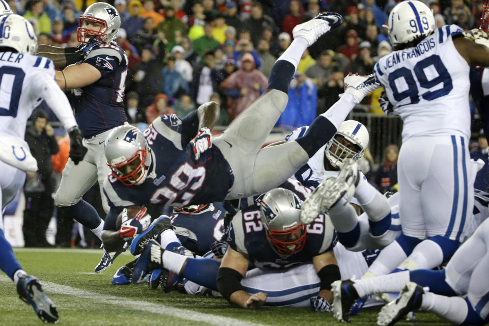 New England Patriots running back LeGarrette Blount (29) dives into the end zone for a touchdown during the first half of an AFC divisional NFL playoff football game against the Indianapolis Colts in Foxborough, Mass., Saturday, Jan. 11, 2014. (AP Photo/Matt Slocum)