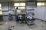 Afghan school students are treated at a hospital after a bomb explosion near a school in west of Kabul, Afghanistan, Saturday, May 8, 2021. A bomb exploded near a school in west Kabul on Saturday, killing several people, many them young students, an Afghan government spokesmen said. (AP Photo/Rahmat Gul)