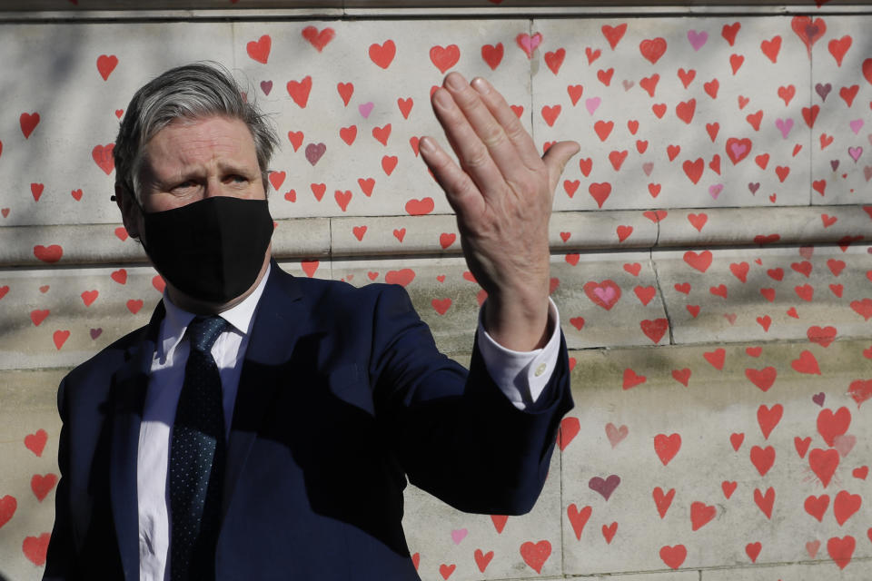 FILE - Keir Starmer, leader of Britain's opposition Labour Party, speaks to the media during a visit to the COVID-19 Memorial Wall opposite the Houses of Parliament on the Embankment in London, Monday March 29, 2021. (AP Photo/Kirsty Wigglesworth, File)