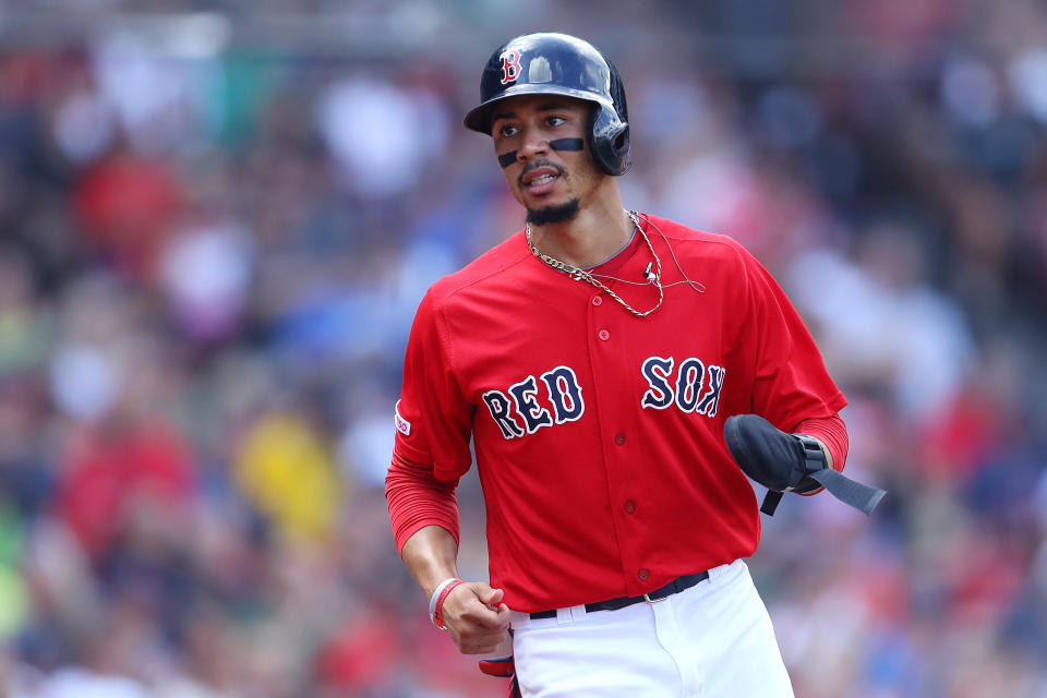 BOSTON, MASSACHUSETTS - AUGUST 18: Mookie Betts #50 of the Boston Red Sox runs to the dugout after scoring a run against the Baltimore Orioles during the third inning at Fenway Park on August 18, 2019 in Boston, Massachusetts. (Photo by Maddie Meyer/Getty Images)