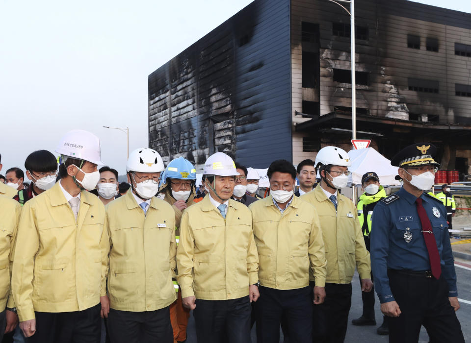 South Korean Prime Minister Chung Se-kyun, third from left, visits after a fire engulfed a construction site in Icheon, South Korea, Wednesday, April 29, 2020. One of the South Korea’s worst fires in years broke out at the construction site. (Hong Ki-won/Yonhap via AP)