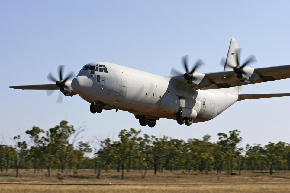 In this photo provided by the Australian Defence Force a AC-130 Hercules aircraft practices landing on the dirt airstrip at Benning Field during Exercise Northern Station 2007 near Townsville, Australia, Sept. 25, 2007. Australia said Monday, July 24, 2023, it will buy 20 new C-130 Hercules from the United States in a 9.8 billion Australian dollar ($6.6 billion) deal that will increase by two-thirds the size of the Australian air force’s fleet of its second-largest heavy transport aircraft. (ADF via AP)