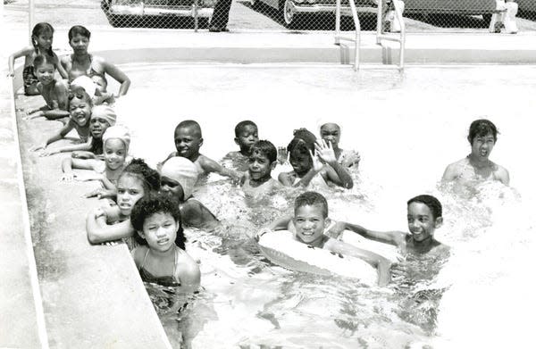 Swimming class at the Robinson Trueblood swimming pool in the Frenchtown subdivision of Tallahassee. Trueblood on Dade Street was the only pool where blacks could swim and train as lifeguards. Identified, in the foreground: at left is Carol Award and at the right is Edwin Thorpe; 4th from the bottom at left is Jean Thorpe; in the middle of the picture with bathing cap is Elaine Thorpe; and background right is Linda Award.
