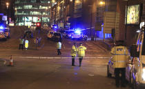 <p>Emergency services work at Manchester Arena after reports of an explosion at the venue during an Ariana Grande gig in Manchester, England Monday, May 22, 2017. Several people have died following reports of an explosion Monday night at an Ariana Grande concert in northern England, police said. A representative said the singer was not injured. (Peter Byrne/PA via AP) </p>
