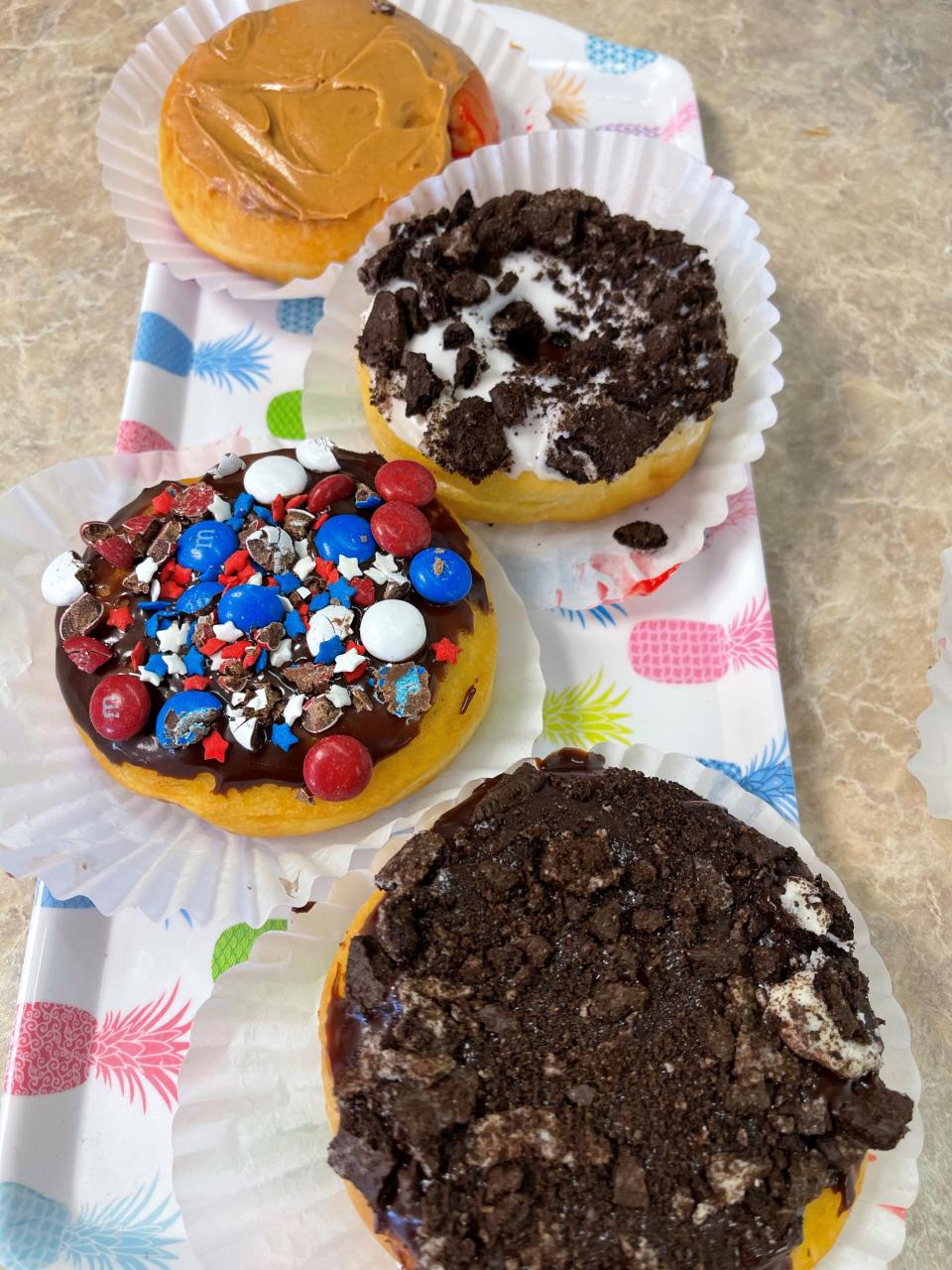 Some of the "different" doughnuts at Crust N Krumbs in Vineland include peanut butter and jelly (top), Oreo topped with white icing, white cream-filled with M&Ms and white cream-filled with crushed Oreos on top.