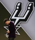 <p>Dejounte Murray walks up to the stage after being selected 29th overall by the San Antonio Spurs during the NBA basketball draft, Thursday, June 23, 2016, in New York. (AP Photo/Frank Franklin II) </p>