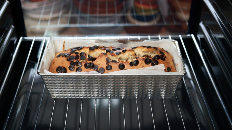 A loaf of chocolate chip banana bread baking in the oven