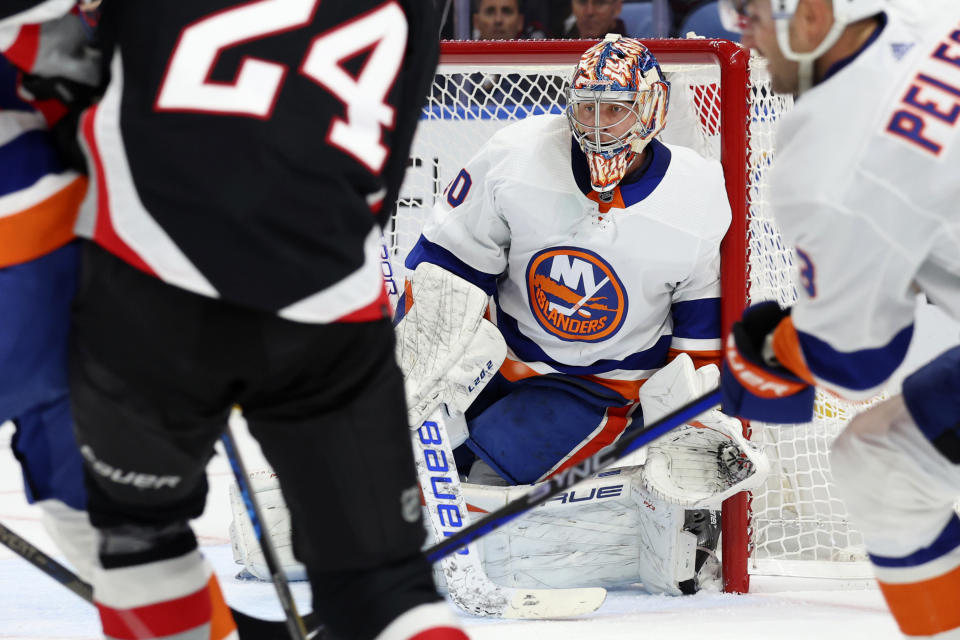 New York Islanders goaltender Semyon Varlamov (40) looks for the puck in traffic during the first period of an NHL hockey game against the Buffalo Sabres Saturday, Oct. 21, 2023, in Buffalo, N.Y. (AP Photo/Jeffrey T. Barnes)