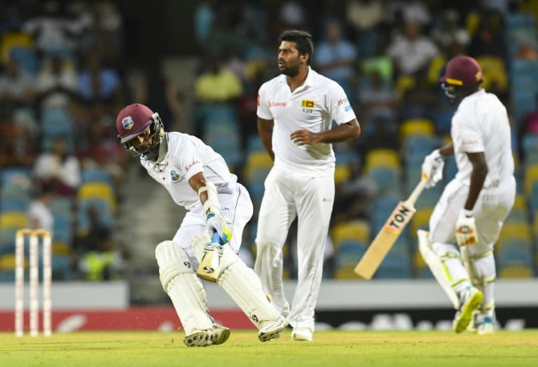 Kasun Rajitha (L) of Sri Lanka celebrates the dismissal of Shai Hope of West Indies on Day 1 of their 3rd Test match, at Kensington Oval in Bridgetown, Barbados, on June 23, 2018