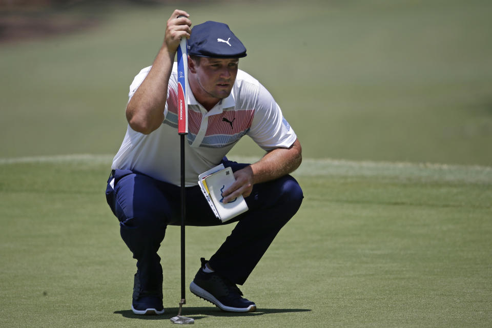 Bryson DeChambeau lines up a shot on the first green during the final round of the RBC Heritage golf tournament, Sunday, June 21, 2020, in Hilton Head Island, S.C. (AP Photo/Gerry Broome)
