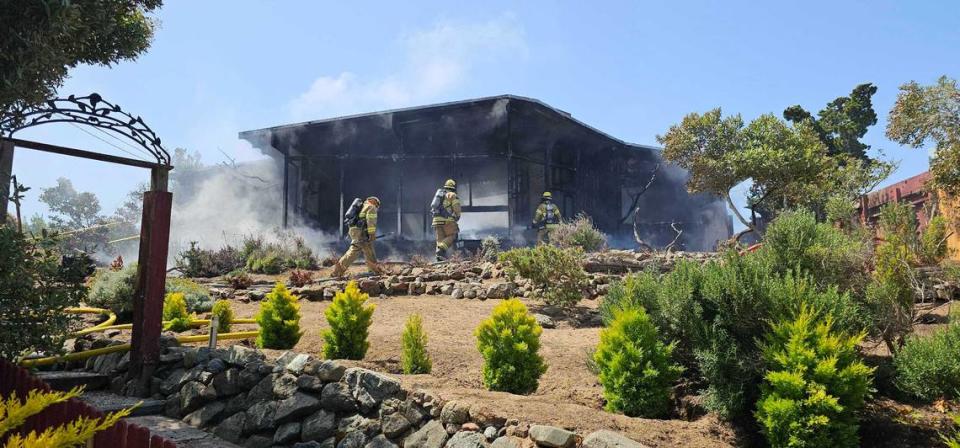 Firefighters respond to a fire that fully engulfed a home near the 600 block of Santa Lucia Avenue and Second Street on May 21, 2024.