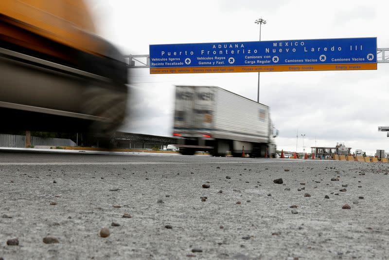 Trucks are seen arriving at a border customs control to cross into U.S. at the World Trade Bridge in Nuevo Laredo