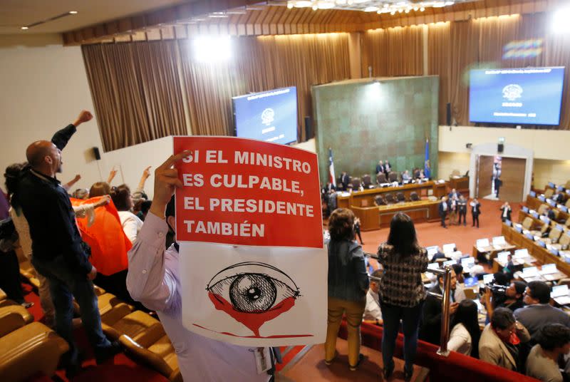 Demonstrators opposing the government shout slogans after the lawmakers rejected a move to impeach President Sebastian Pinera during a session at the congress in Valparaiso