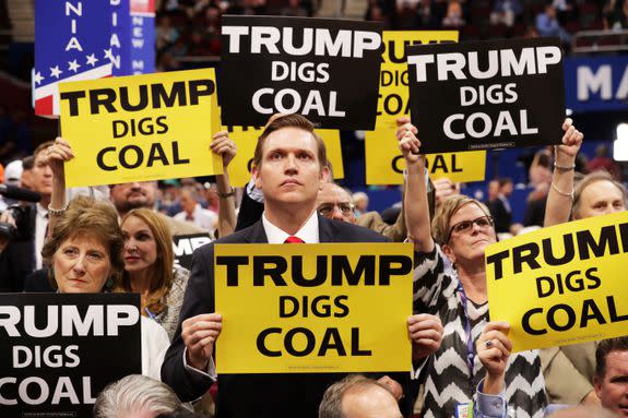 Delegates hold pro-coal signs at the Republican National Convention in Cleveland, Ohio, July 19, 2016.